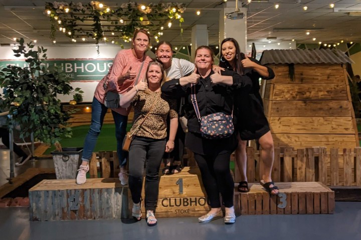 a woman standing in front of a building
