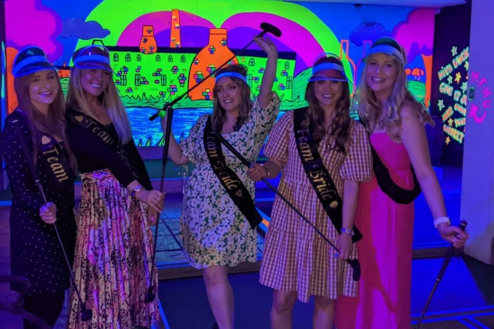 group playing glow golf