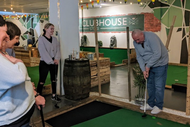 a group of people standing in a room