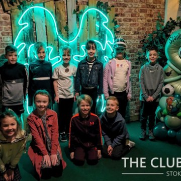 a group of people standing in front of a building