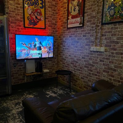 a living room with a brick wall
