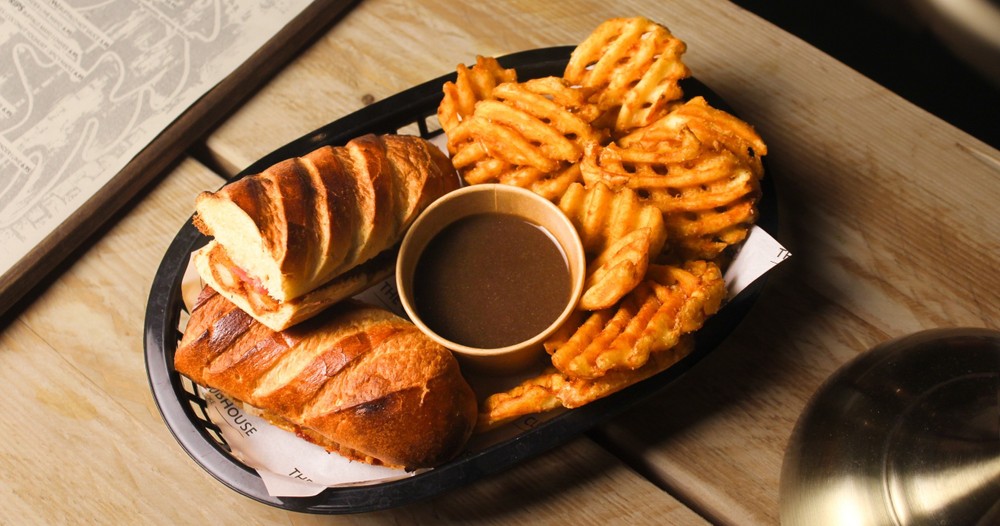 a plate of food sitting on top of a wooden table