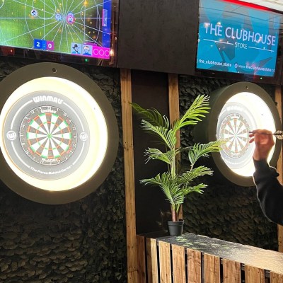 a man playing darts