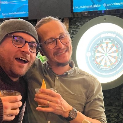 two men posing for photo