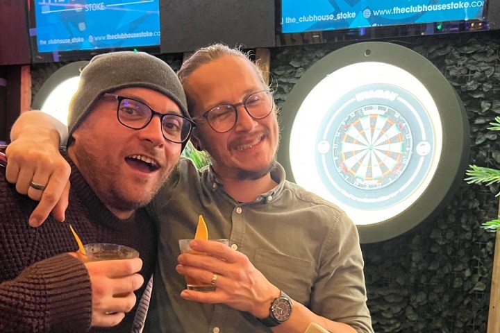 two men posing for photo