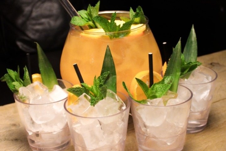 a glass of orange juice on a table