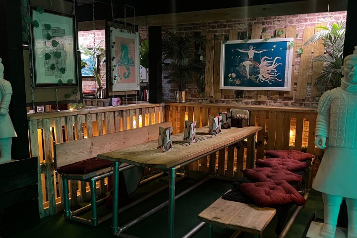 a person sitting on a bench in a room