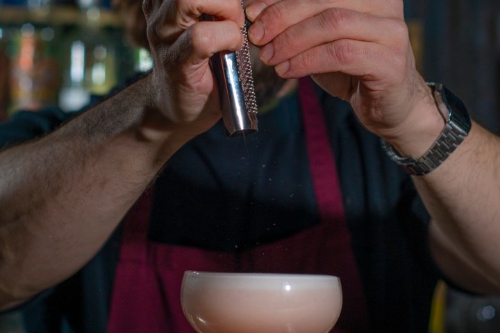 a man drinking from a wine glass