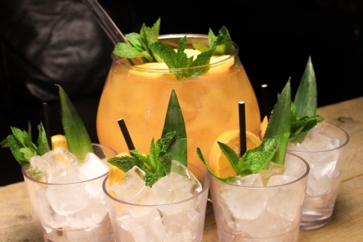 a plate of food and a glass of orange juice