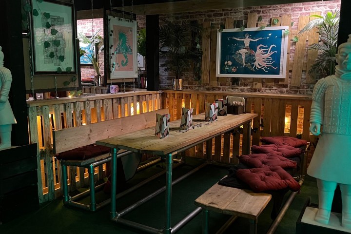 a woman sitting at a table in a room