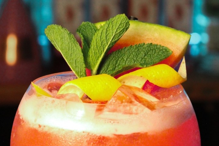 a close up of a bowl of oranges on a table