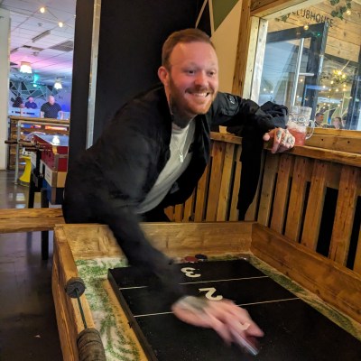 man playing shuffleboard