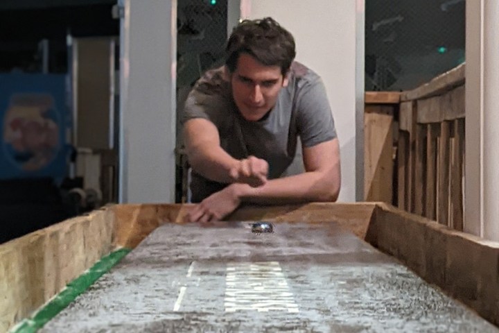 a man sitting in front of a building