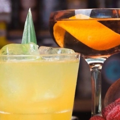 a close up of a glass of orange juice