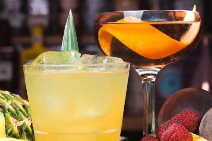 a close up of a glass of orange juice