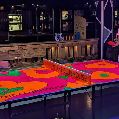 a person standing in front of a cake