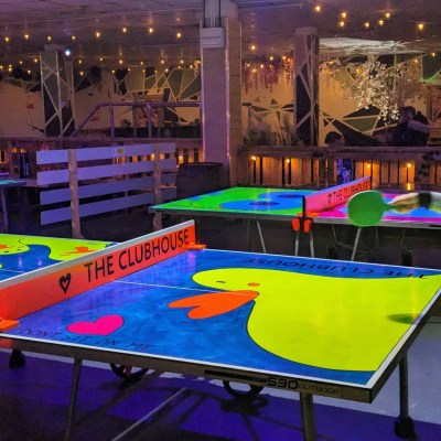 a person standing in front of a table