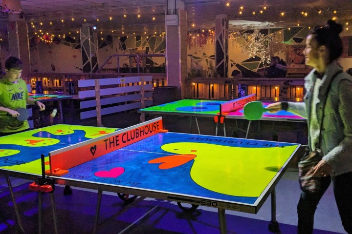 a person standing in front of a table