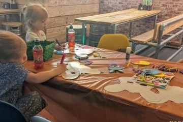 a young boy sitting at a table